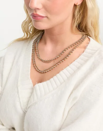 Accessorize layered bead necklace in gold
