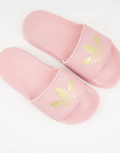 adidas Originals Adilette lite sliders in pink with gold trefoil