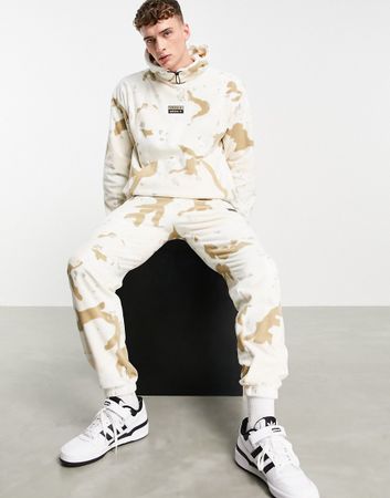 adidas Originals RYV fleece joggers in beige camo print-Neutral