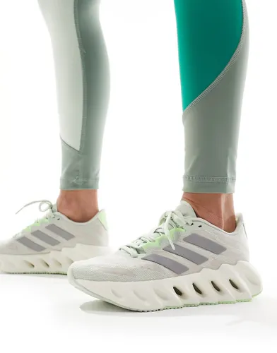 adidas Running Switch FWD trainers in soft green and silver