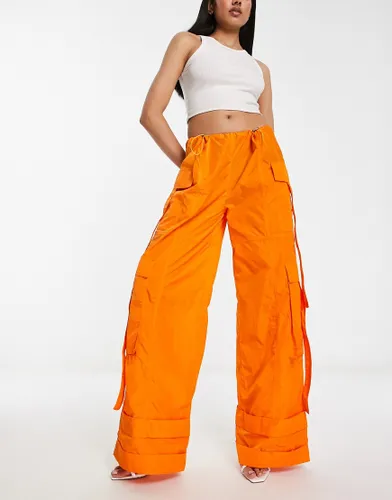 Annorlunda nylon oversized parachute trousers in bright orange