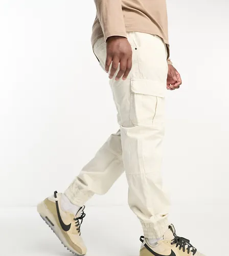 Another Influence Plus cuffed cargo trousers in off white
