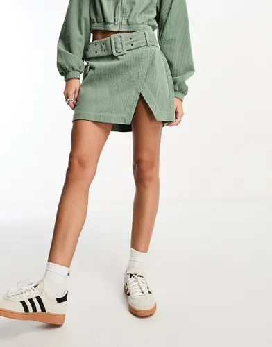 ASOS DESIGN cord wrap mini skirt in sage co-ord-Green