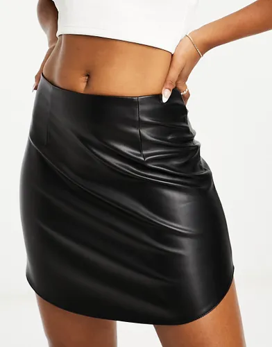 ASOS DESIGN faux leather curved hem mini skirt in black
