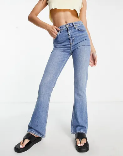 ASOS DESIGN flared jeans in mid blue