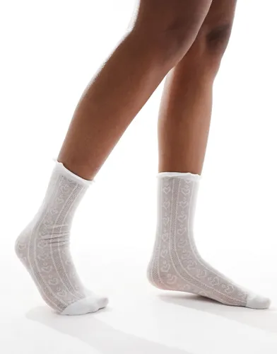 ASOS DESIGN heart pointelle slouch socks with frill in white