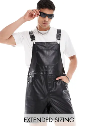 ASOS DESIGN leather look shorter length dungaree in black