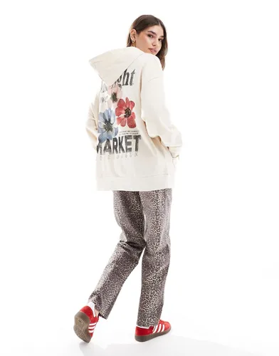 ASOS DESIGN oversized hoodie with flower market graphic in cream-White