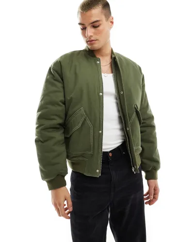 ASOS DESIGN oversized padded jacket in khaki with contrast stitch-Green