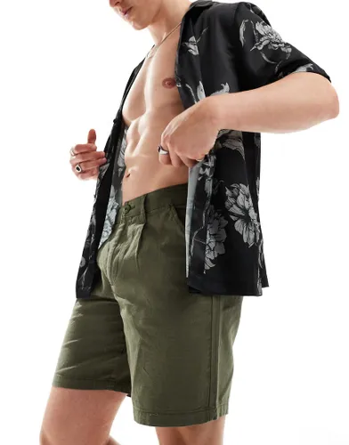ASOS DESIGN pleated regular length linen shorts with fixed waist in khaki-Green
