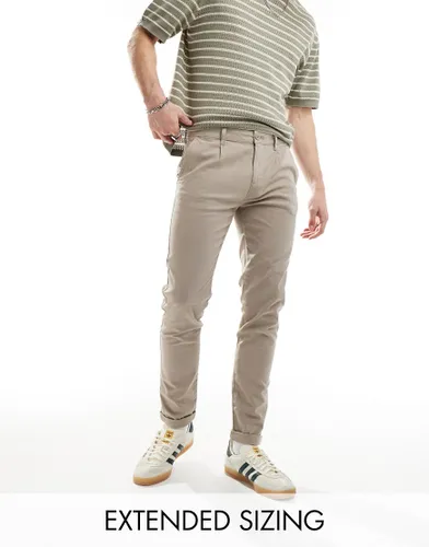 ASOS DESIGN skinny chino in washed beige-Neutral