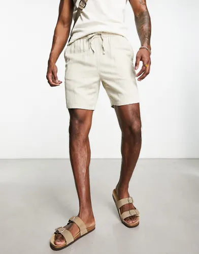 ASOS DESIGN slim texture shorts in mid length in beige-Neutral