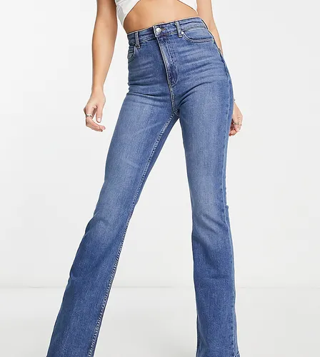 ASOS DESIGN Tall flared jeans in mid blue