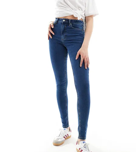 ASOS DESIGN Tall skinny jeans in mid blue