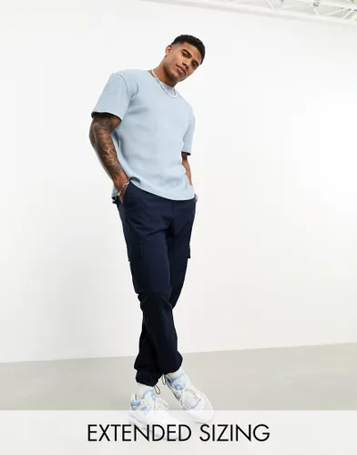 ASOS DESIGN tapered cargo trousers in navy