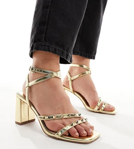 ASOS DESIGN Wide Fit Hampstead studded mid heeled sandals in gold