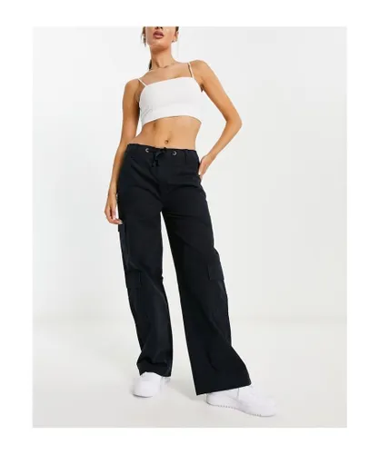 ASOS DESIGN Womens oversized cargo trouser with multi pocket and tie waist in black