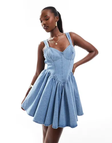 ASOS LUXE denim corseted skater mini dress with bow back in mid wash blue