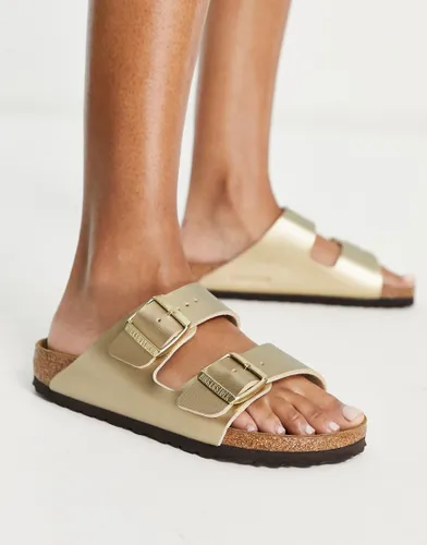 Birkenstock Arizona birko-flor flat sandals in gold