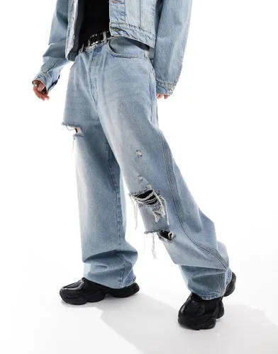COLLUSION X015 co-ord super baggy low rise jeans in lightwash blue with rips
