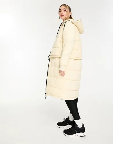 Ellesse Zanibellato longline puffer coat in off white
