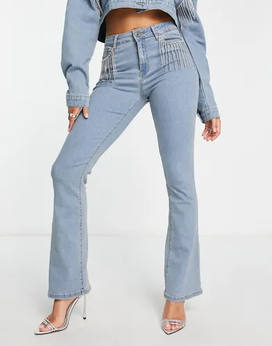 Fae high waist flared jeans with diamante fringe in washed blue