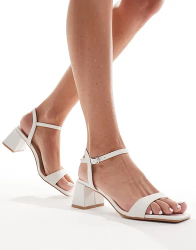 Glamorous low block heeled sandals in white