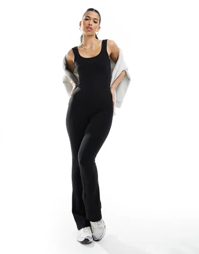 In The Style ribbed scoop neck flared jumpsuit in black