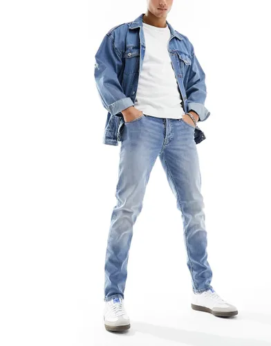 Jack & Jones Glenn slim tapered fit jeans in light wash denim-Blue