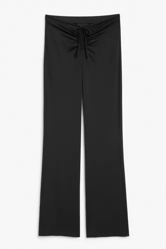Low-waist flared trousers - Black