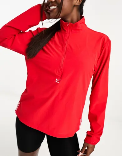 Nike Air Dri-FIT half zip woven jacket in in red