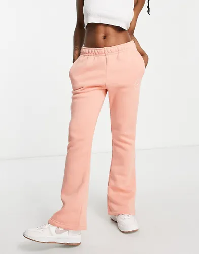 Nike Be Kind flared fleece joggers in madder root-Pink