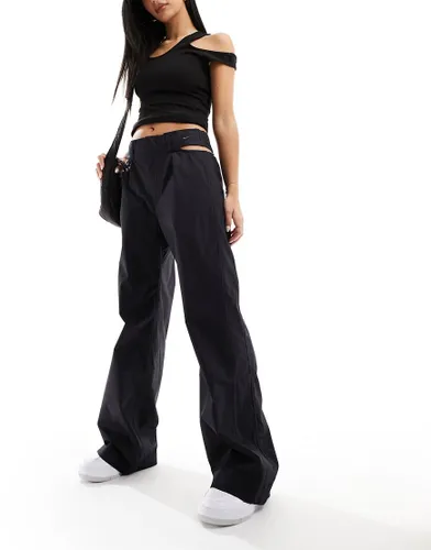 Nike cut out waist woven baggy trousers in black