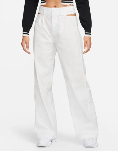 Nike cut out waist woven baggy trousers in white