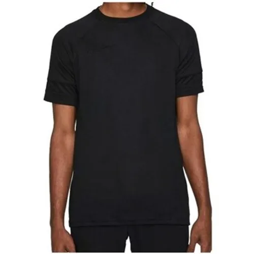 Nike  Drifit Academy  boys's Children's T shirt in Black