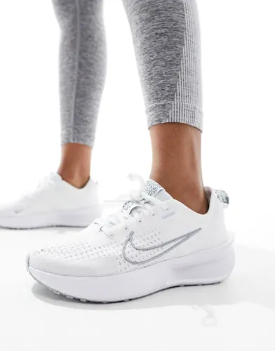 Nike Running Interact Run trainers in white and silver