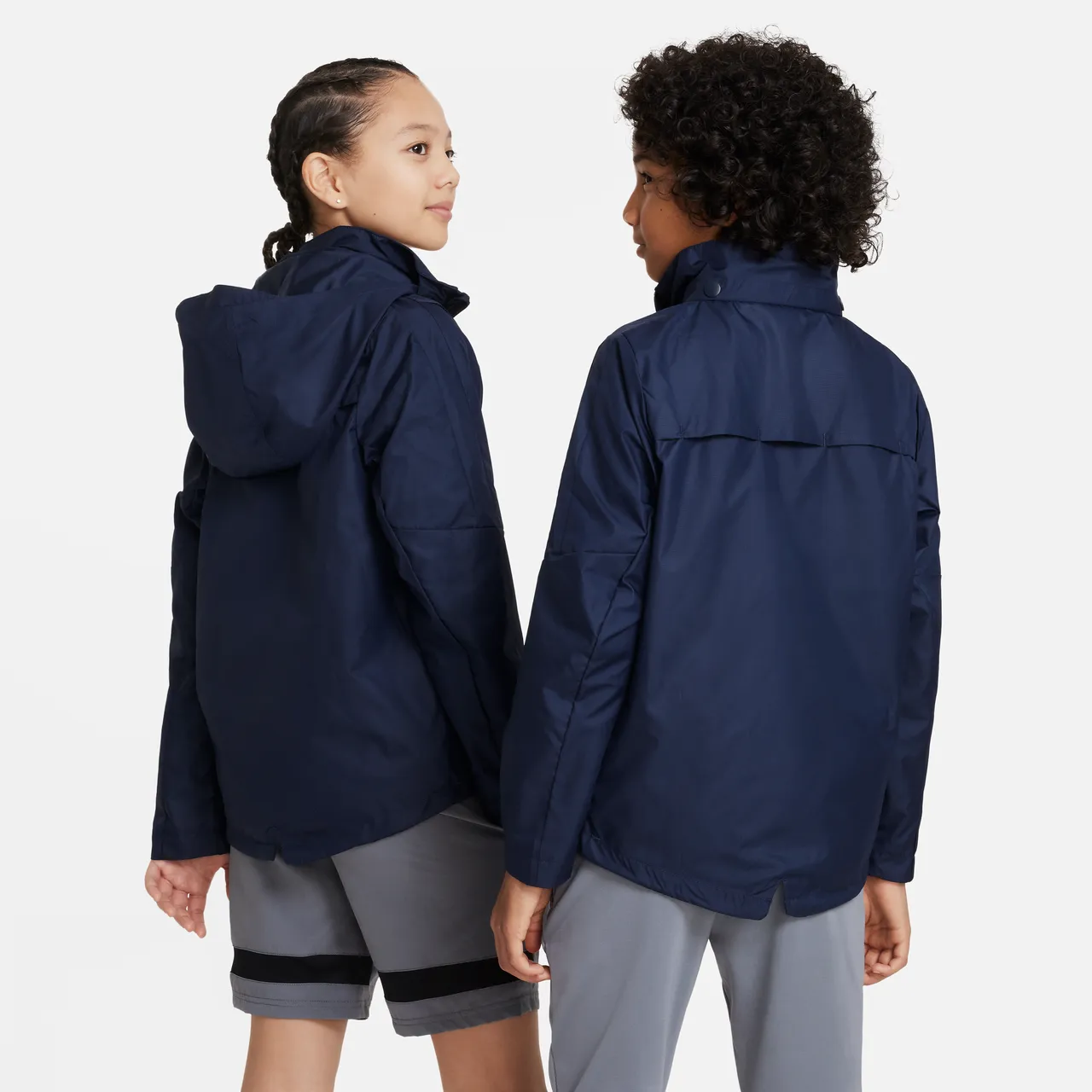 Nike Storm-FIT Academy23 Older Kids' Football Rain Jacket - Blue - Polyester