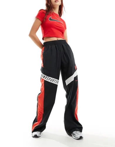 Nike Streetwear woven trackpant in black and red