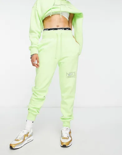 Nike Swoosh graphic joggers in lime green