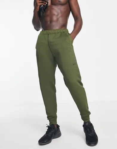 Nike Training Axis Therma-FIT ADV joggers in khaki-Green