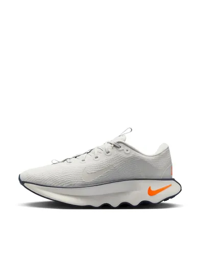 Nike Training Motiva trainers in white and orange