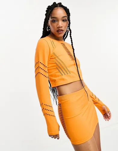 Only seamless cut out mini skirt co-ord in orange