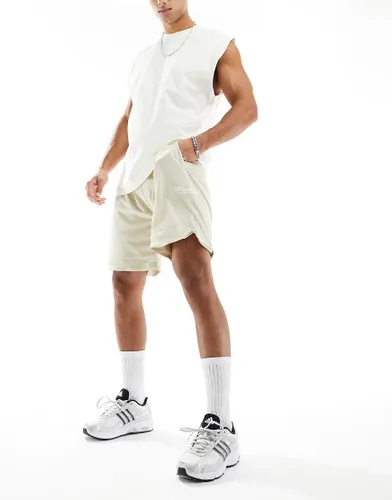 The Couture Club varsity mesh shorts in beige-Neutral