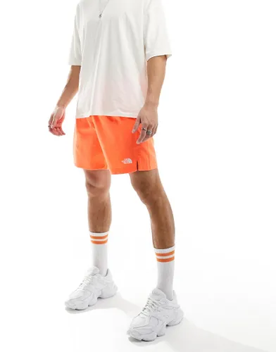 The North Face 24/7 logo shorts in orange