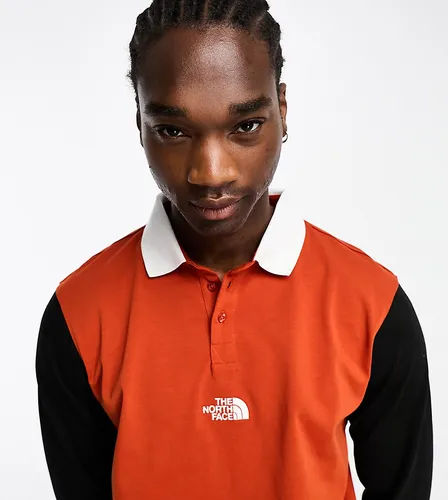 The North Face Rugby heavyweight polo in black and red Exclusive at ASOS-Orange