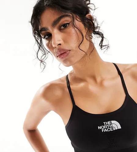 The North Face Training seamless performance sports bra in black Exclusive at ASOS