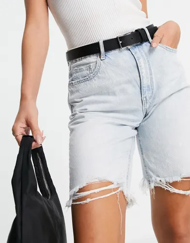 Vero Moda longline denim shorts with rips in bleached wash-Blue